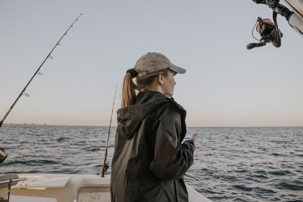 woman fishing on a boat